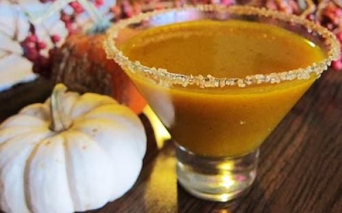 Pumpkin cocktail drink with crushed sugar around the glass rim