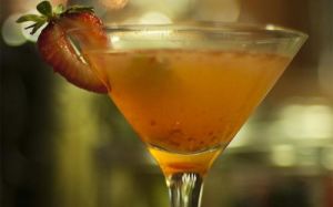 Yellowish orange cocktail drink
